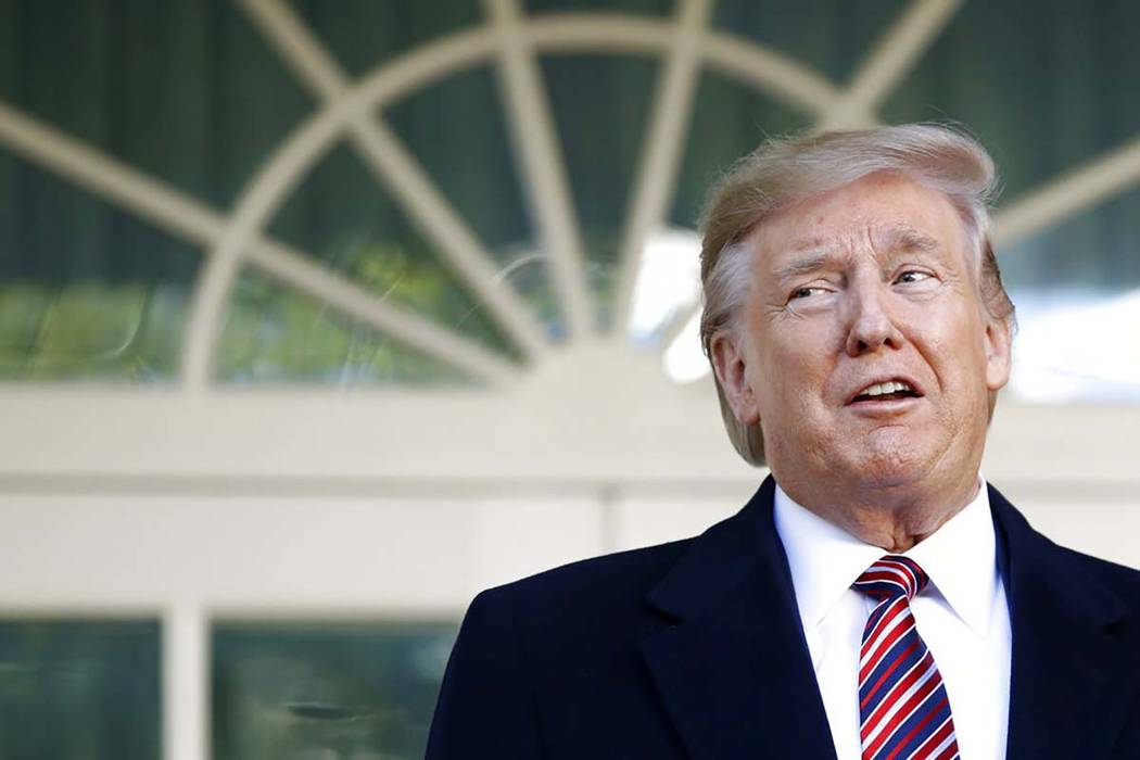 President Donald Trump speaks with members of the press in the Rose Garden of the White House a ...