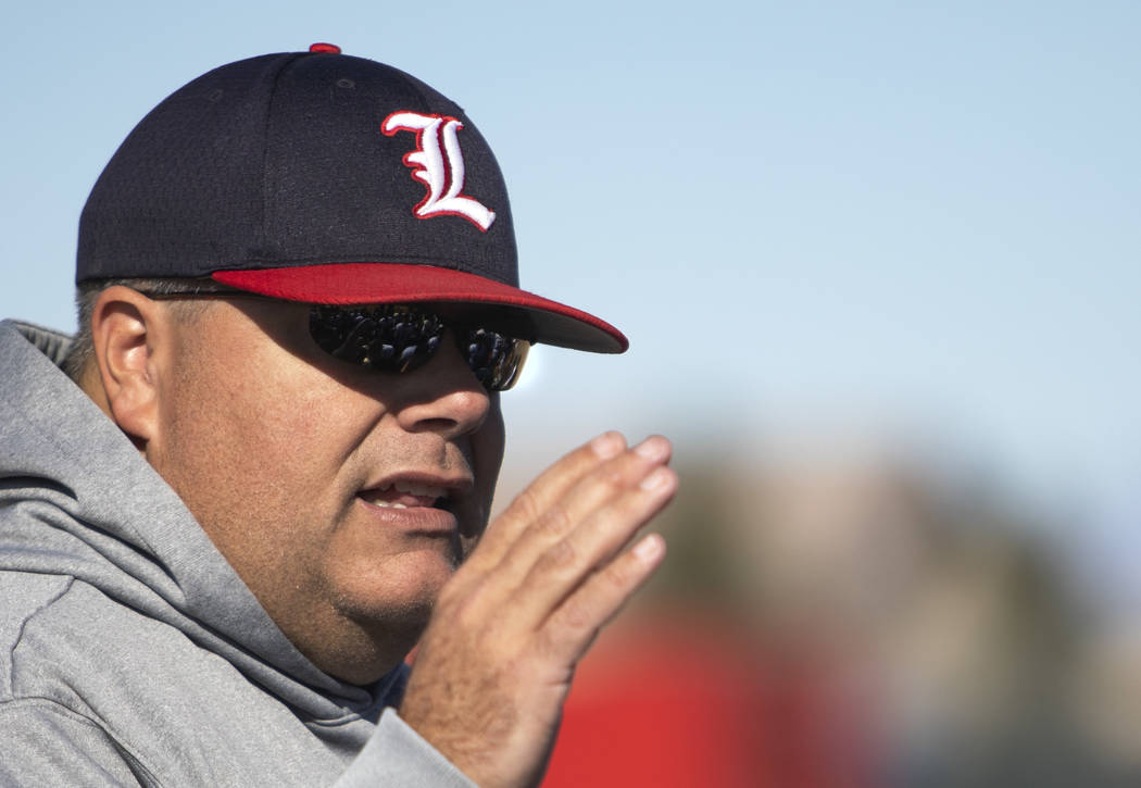 Liberty High School head coach Rich Muraco wraps up practice with a team huddle on Tuesday, Nov ...