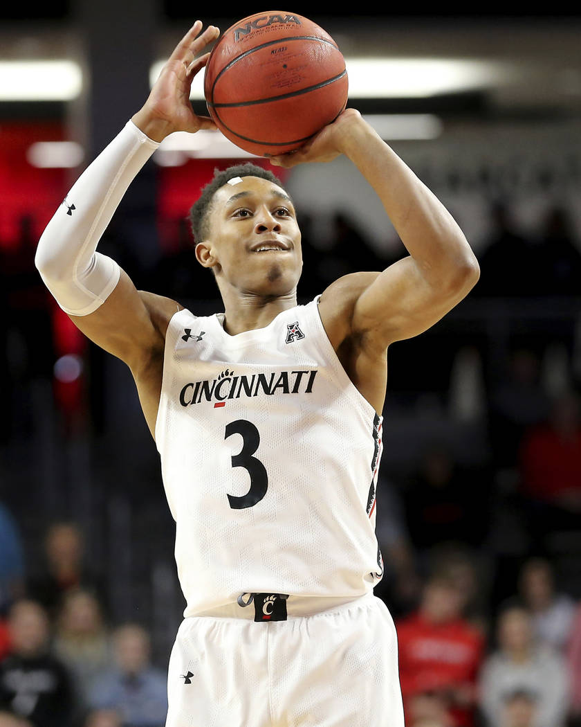 Cincinnati guard Mika Adams-Woods (3) rises for a 3-pointer in the first half against UNLV duri ...