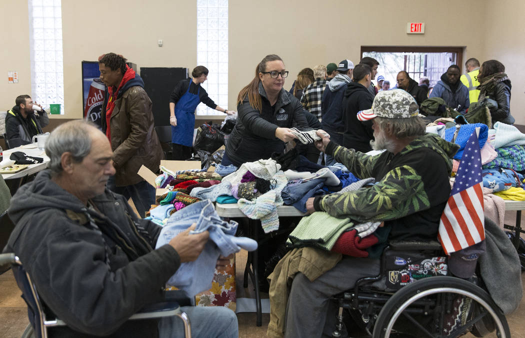 Tami Leavitt, top/right, with Blazes Wish, hands out blankets during the Las Vegas Rescue Missi ...