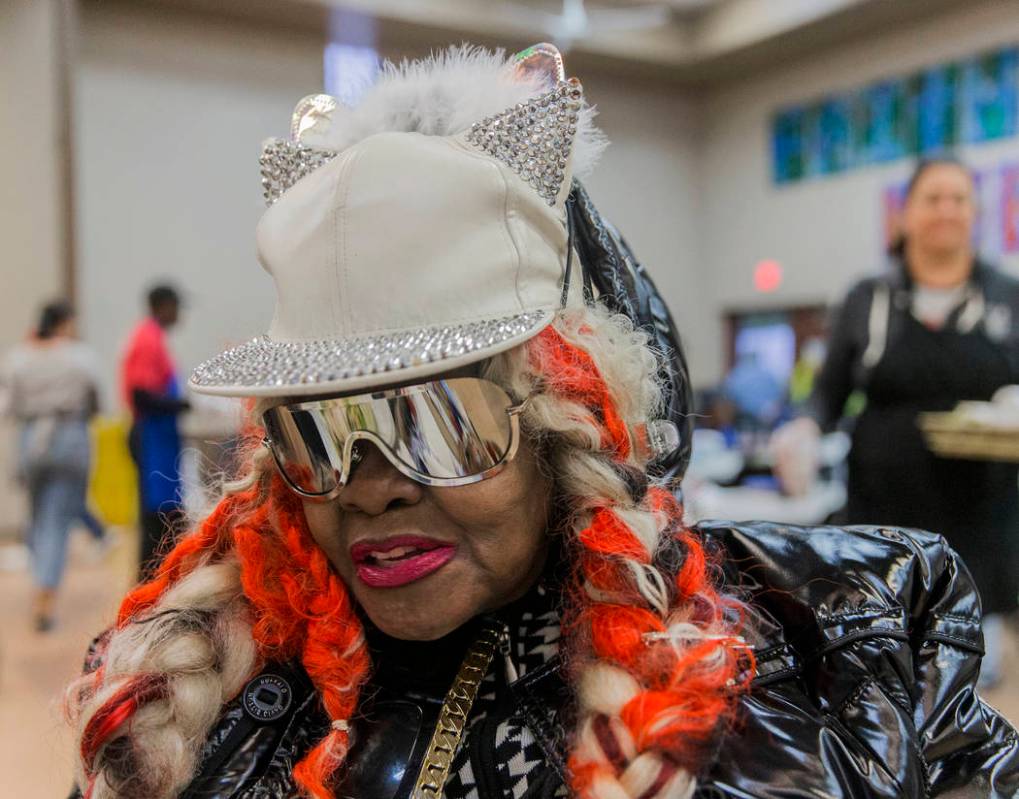 Missy Morgan gets ready to eat during the Las Vegas Rescue Mission's annual Thanksgiving meal o ...