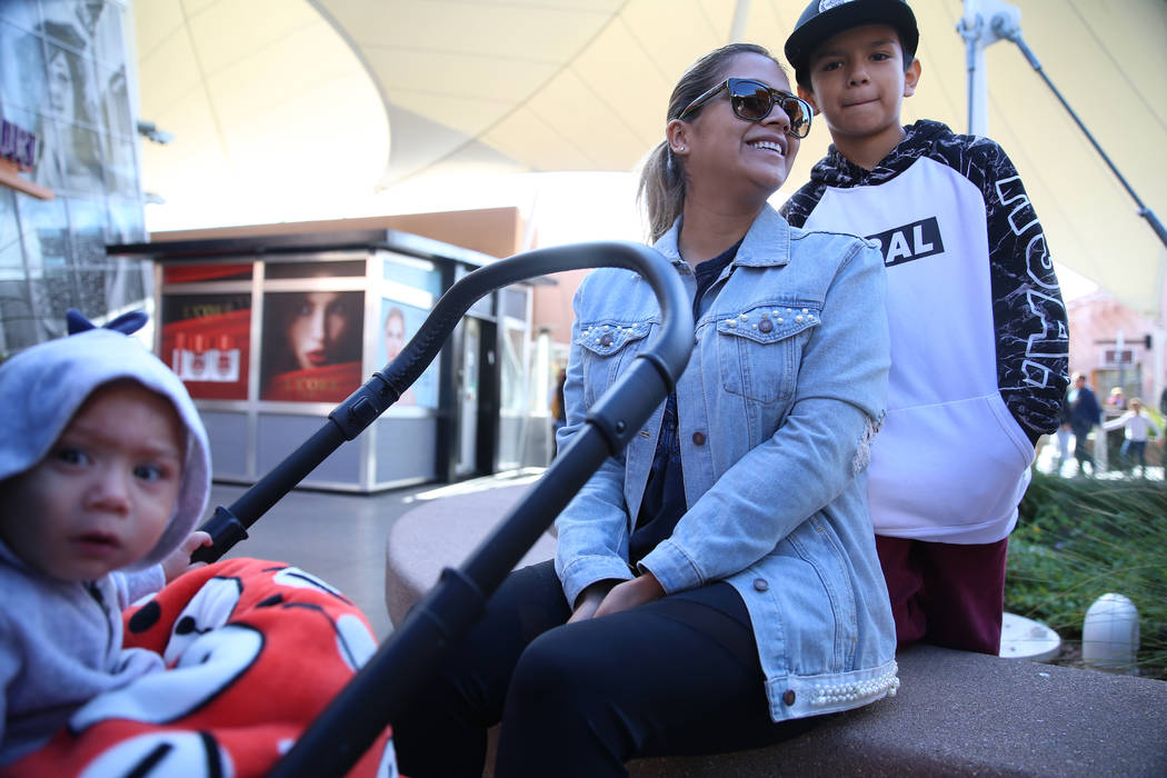 Juanita Ramirez, center, with her sons Bryan, 10, and Jameson, 1, of Las Vegas, shop at Las Veg ...