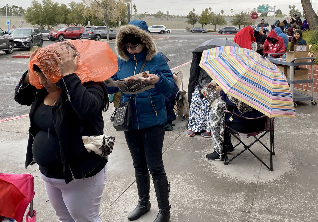 People line up to enter JCPenny at Meadows Mall in Las Vegas for early Black Friday deals on Th ...