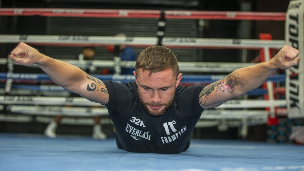 Former two-weight world boxing champion Carl Frampton works his core at the Top Rank Gym, Tuesd ...