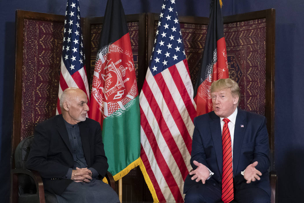 President Donald Trump speaks during a meeting with Afghan President Ashraf Ghani during a surp ...