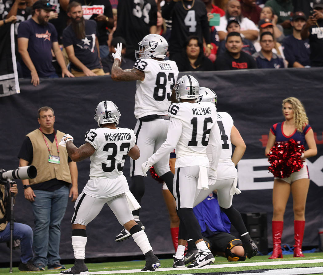 Oakland Raiders tight end Darren Waller (83) celebrates his touchdown with running back DeAndre ...