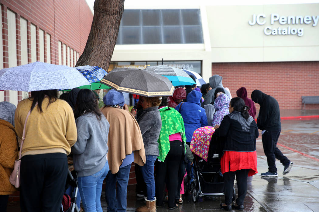 People line up to enter JCPenney at Meadows Mall in Las Vegas for early Black Friday deals on T ...