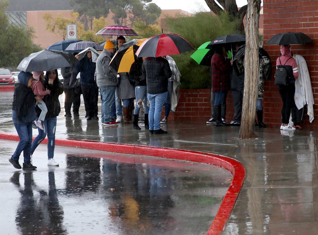 People line up to enter JCPenney at Meadows Mall in Las Vegas for early Black Friday deals on T ...