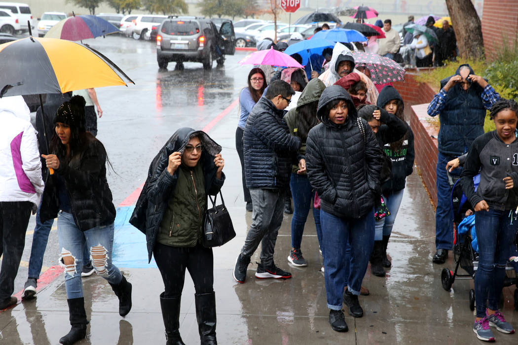 People line up to enter JCPenney at Meadows Mall in Las Vegas for early Black Friday deals on T ...