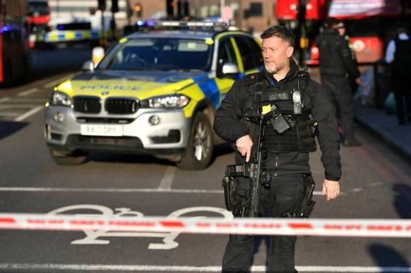 Police at the scene of an incident on London Bridge in central London following a police incide ...