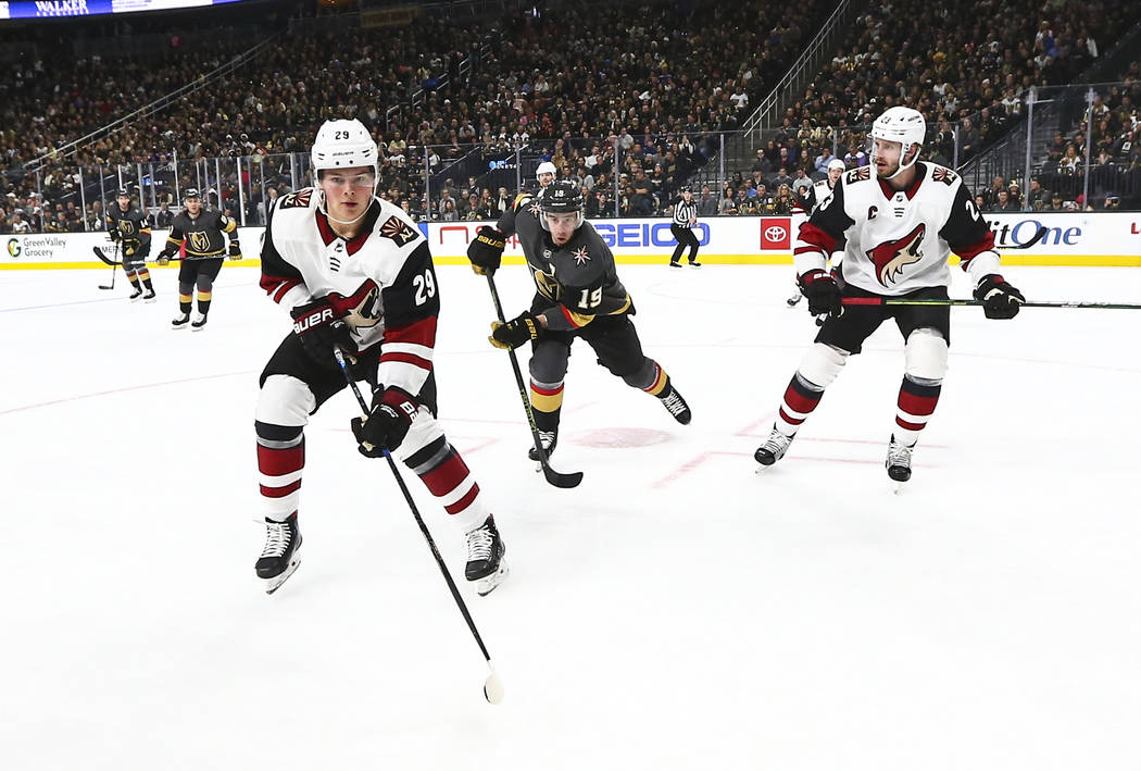 Arizona Coyotes' Barrett Hayton (29), Golden Knights' Reilly Smith (19) and Coyotes' Oliver Ekm ...