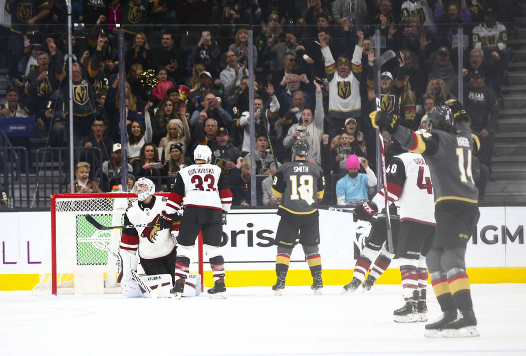 Golden Knights' Nicolas Hague (14), far right, celebrates a goal by Alex Tuch (89) against Ariz ...