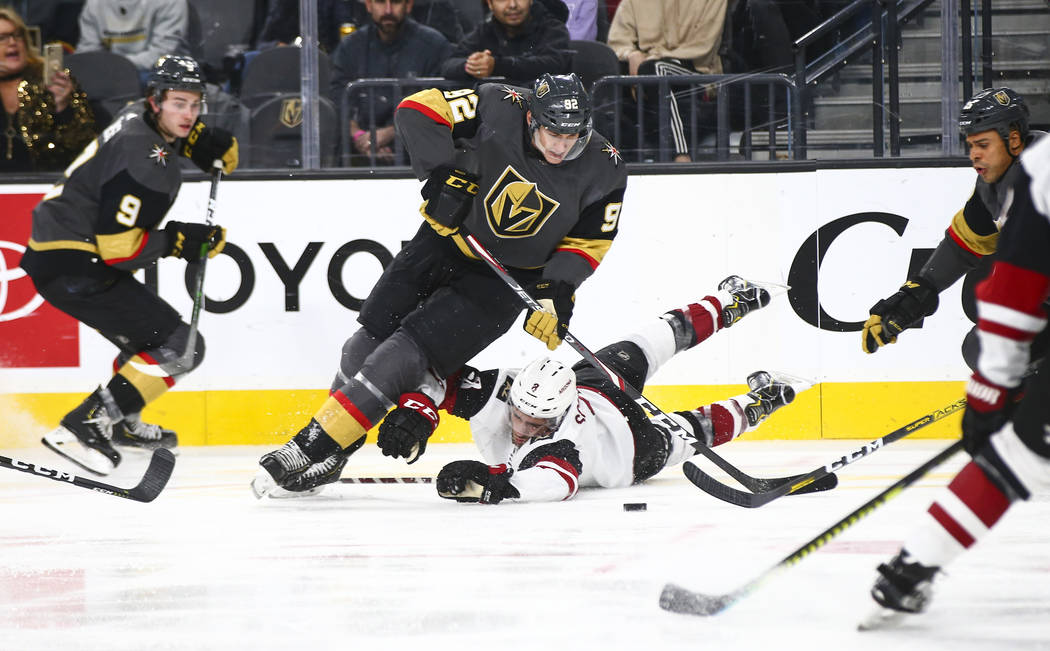 Golden Knights' Tomas Nosek (92) skates past Arizona Coyotes' Nick Schmaltz (8) during the thir ...