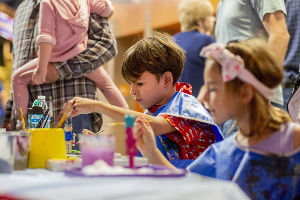 Harrison Taylor, 7, of Las Vegas, paints a nutcracker ornament at the Discovery Children's Muse ...