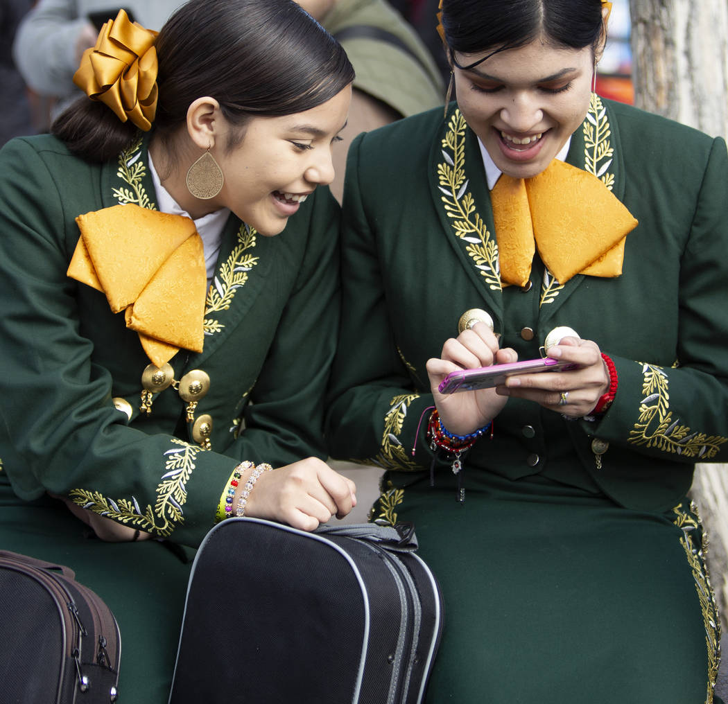 Mariachi bandmates Valeria Ibarra, 16, left, and Jasline Saltiear, 16, right, both students at ...