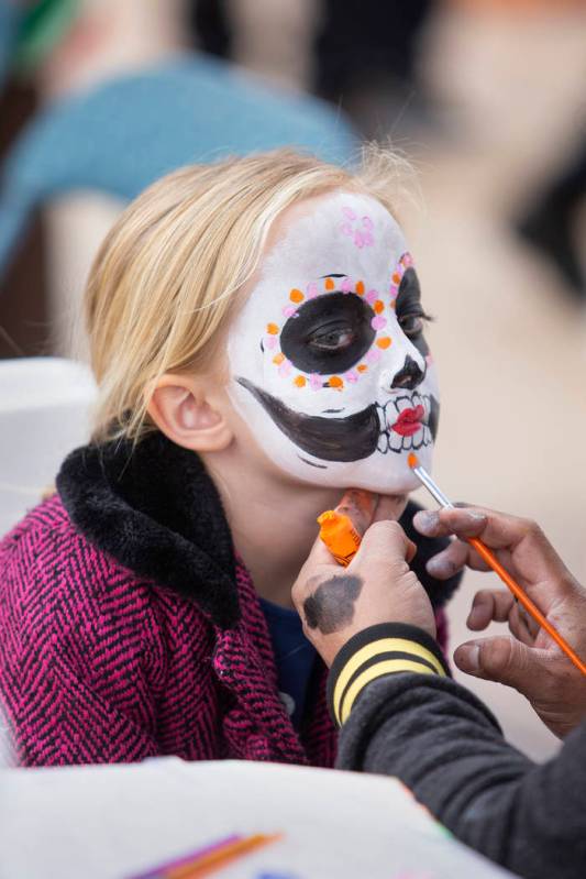 Charlotte Bright, 5, of Las Vegas, has her face painted as a sugar skull at the Las Vegas Tamal ...