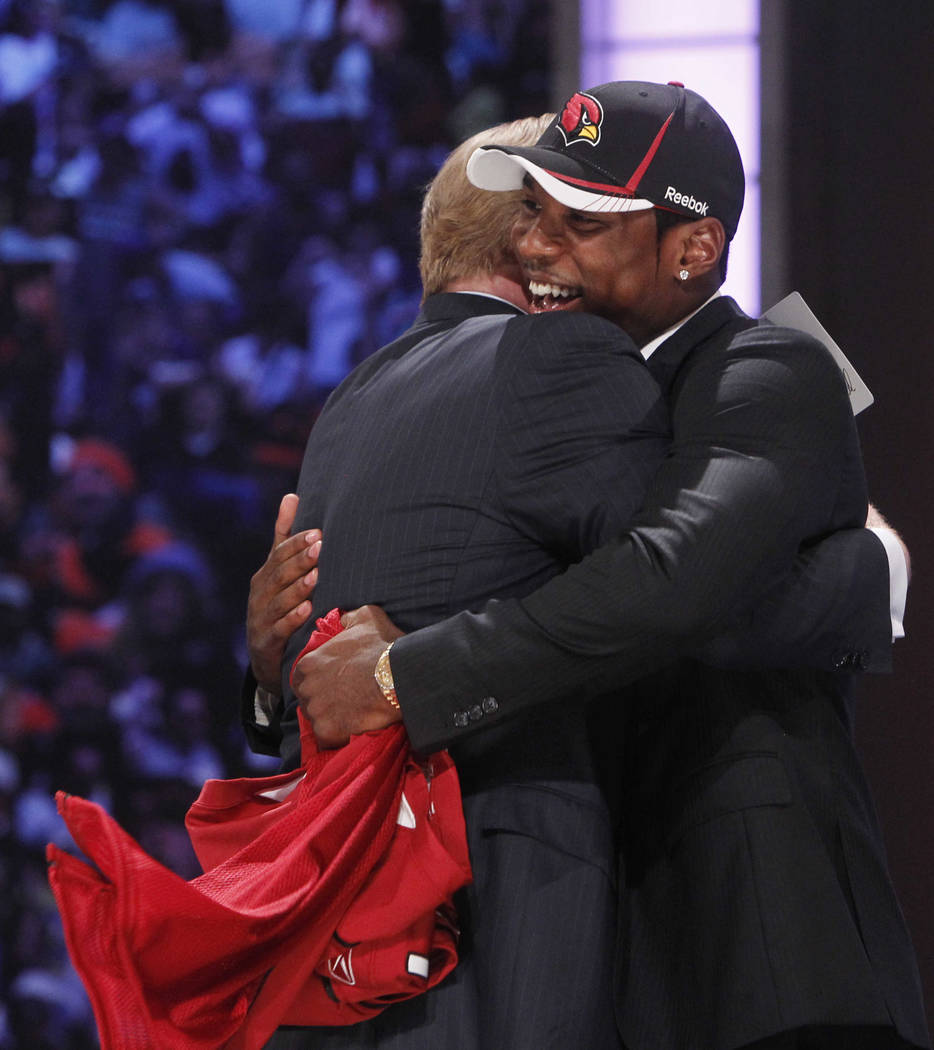 LSU cornerback Patrick Peterson, right, hugs NFL commissioner Roger Goodell after he was select ...