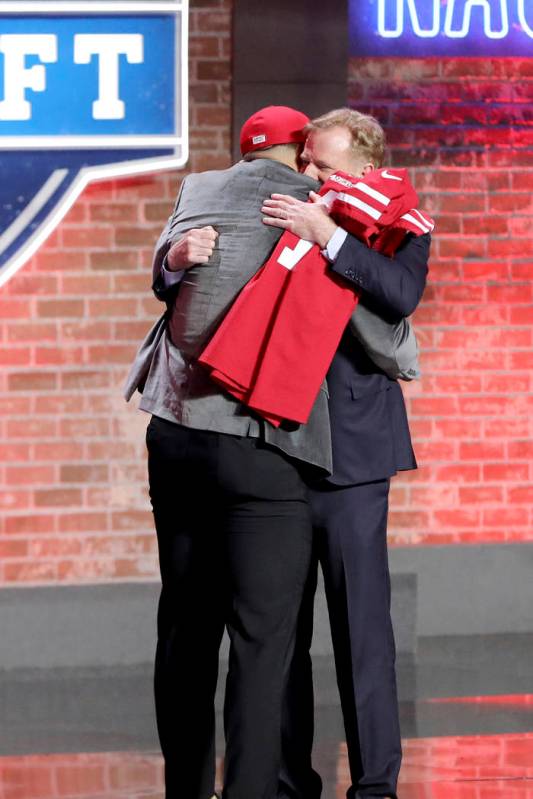 Commissioner Roger Goodell hugs Nick Bosa after Bosa was selected by the San Francisco 49ers wi ...