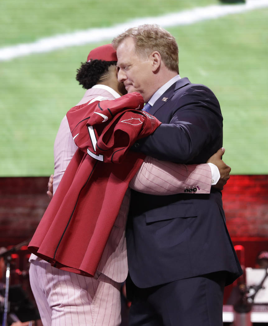 Oklahoma quarterback Kyler Murray embraces NFL Commissioner Roger Goodell after the Arizona Car ...