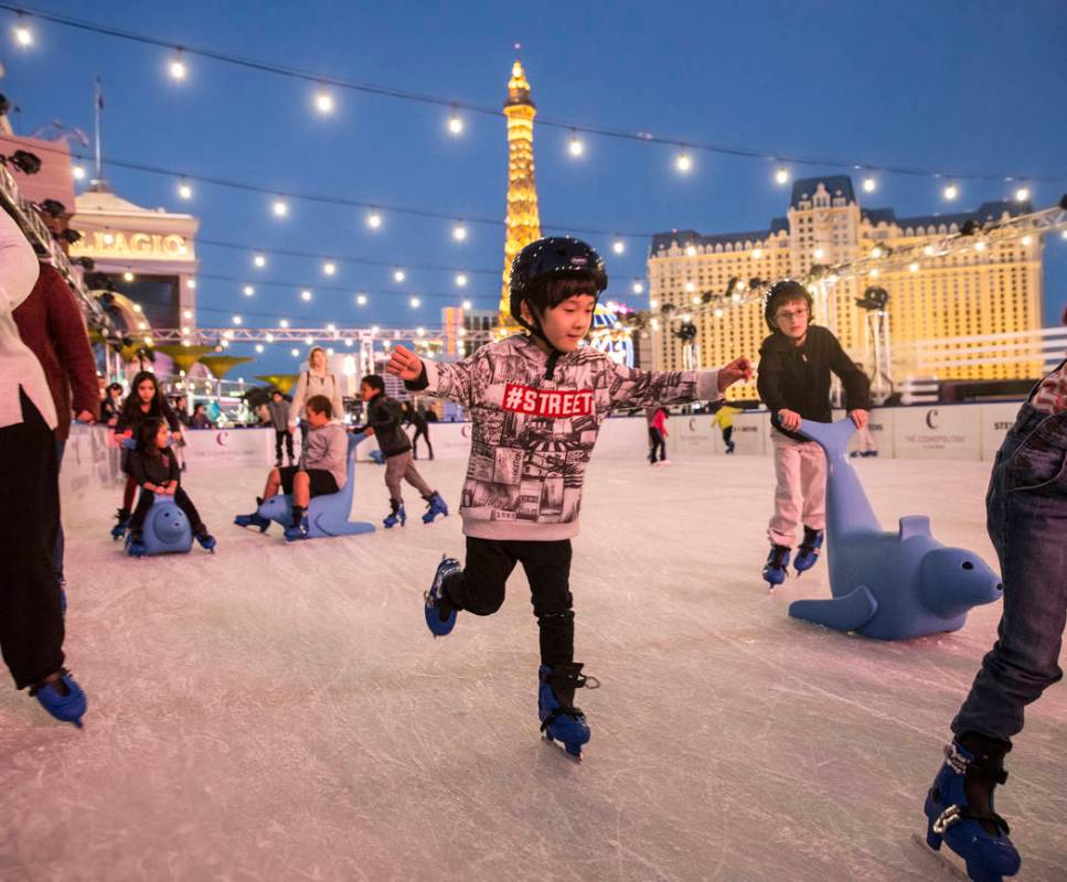 Skaters enjoy the last moments of light at dusk at the Cosmopolitan of Las Vegas Ice Rink on Mo ...
