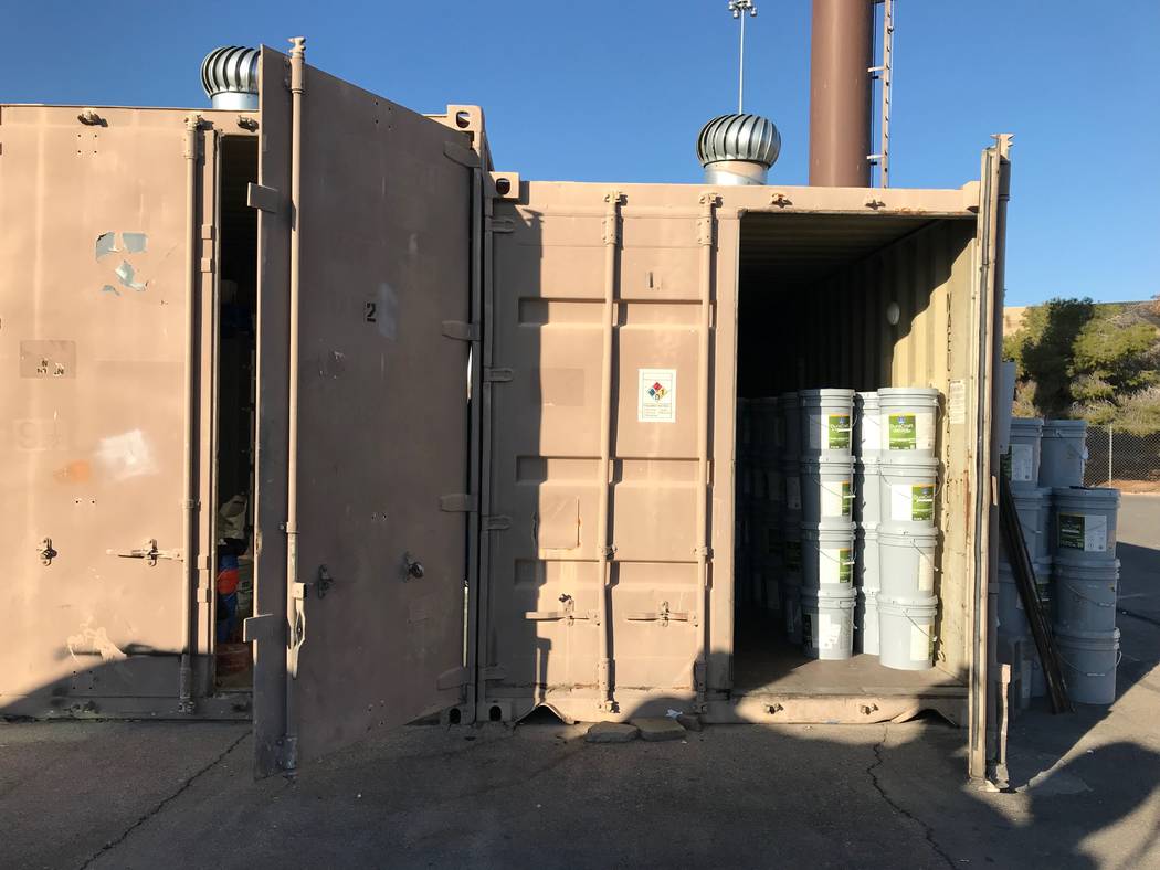 Buckets of paint fit into large containers in North Las Vegas. The graffiti crew has a variety ...