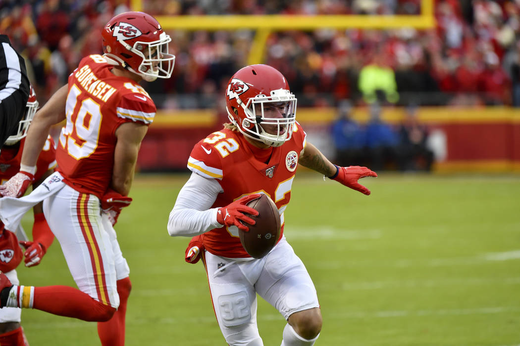 Kansas City Chiefs safety Tyrann Mathieu (32) carries the ball after an interception against th ...