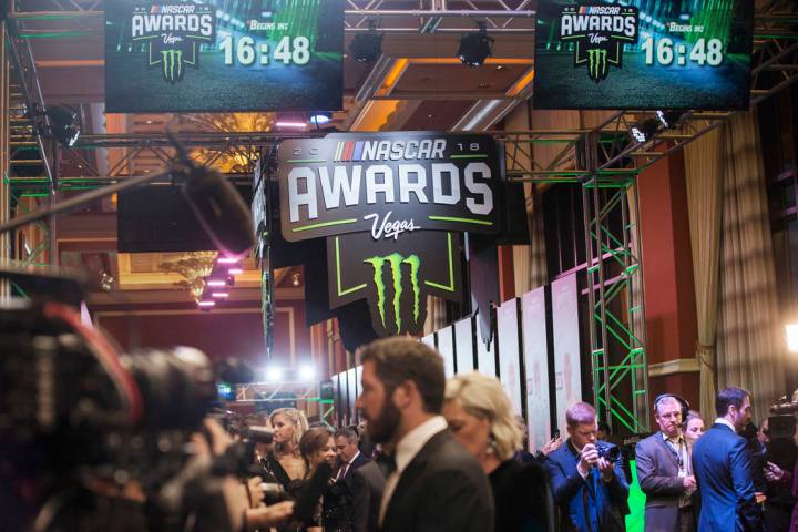 Drivers take photos during the Fan Red Carpet on Thursday, Nov. 29, 2018, at Wynn Las Vegas, in ...