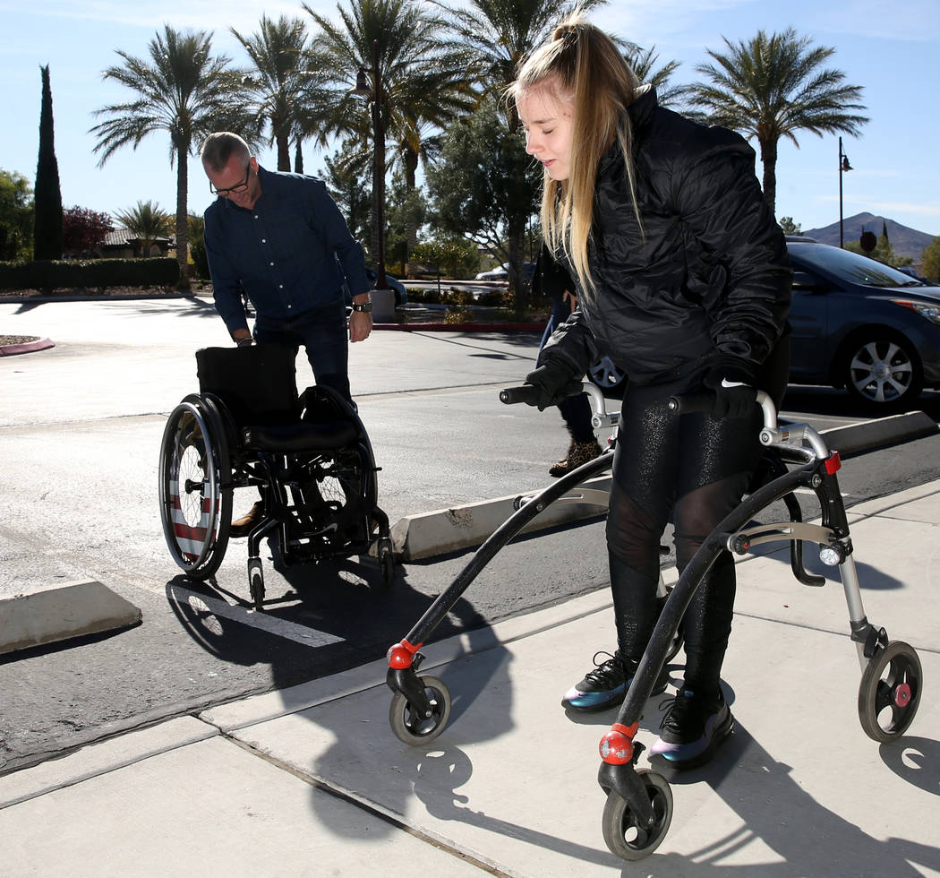 Philomena "Mena" Hawkins, 17, sets out on a training walk with her father Roger Hawkins near he ...