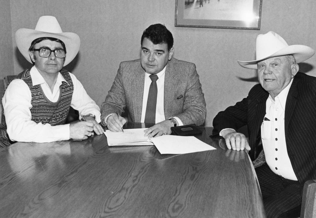 Shawn Davis, shown here (at left) with Phil Arce and Benny Binion, executes the agreement to br ...