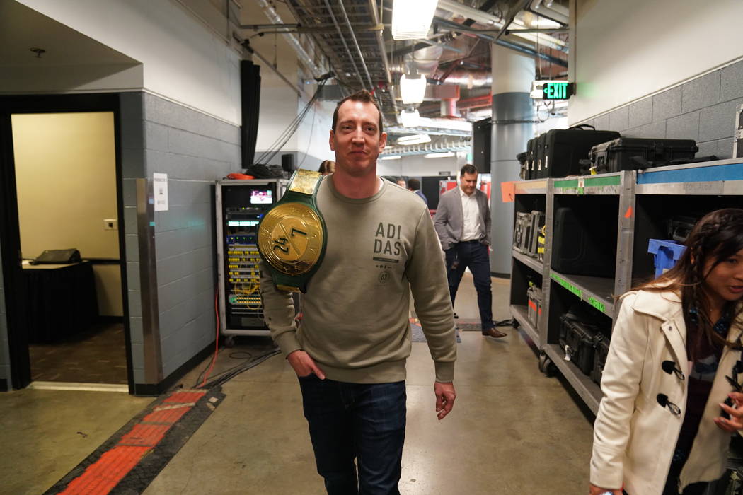 NASCAR Monster Cup champion Kyle Busch walks backstage at Bridgestone Arena in Nasvhille, Tenn. ...