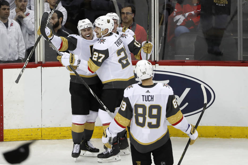 A hat sails onto the court as Vegas Golden Knights center Jonathan Marchessault (81) celebrates ...