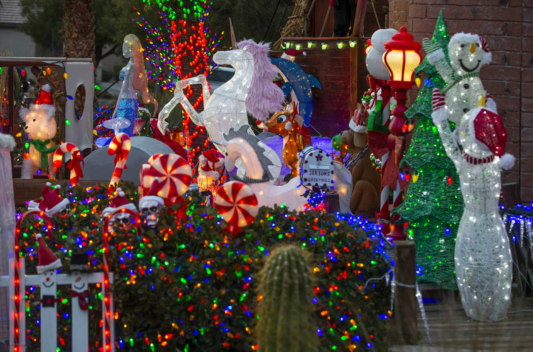 A collection of the holiday lights in the yard of Maria and Juan Torres, which will be featured ...