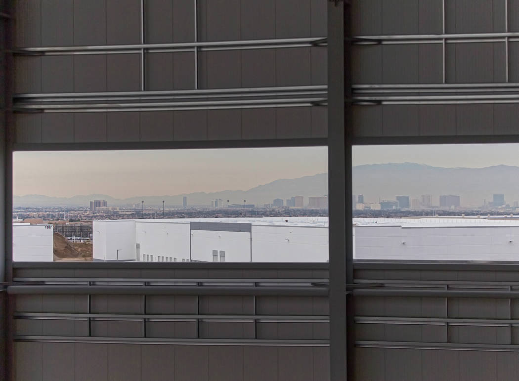 The Las Vegas skyline through a panel of windows at the future Raiders headquarters and practic ...