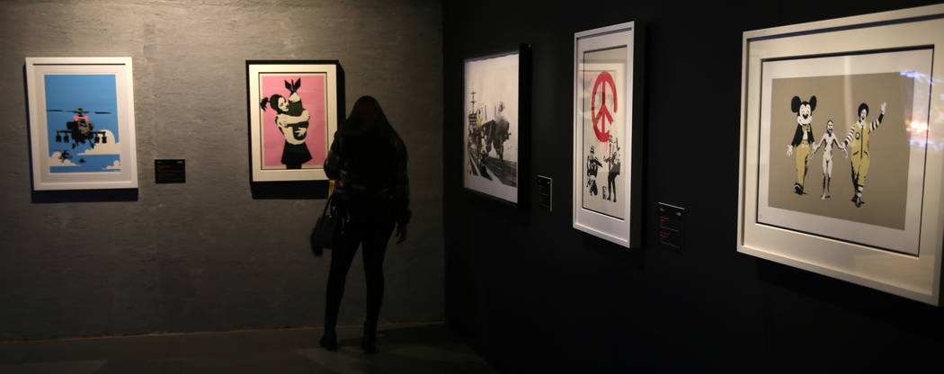 Taylor Misukonis of St. Louis takes in "Banksy: Genius or Vandal" at Immersion Vegas ...