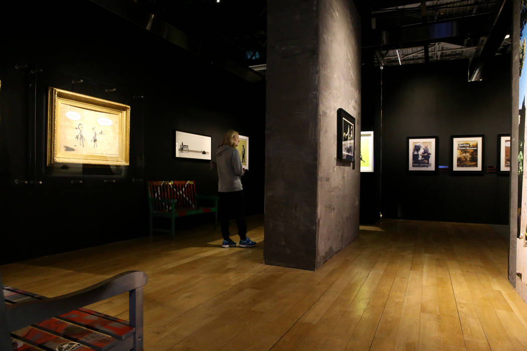 Tiff Feldman of Canada checks out "Banksy: Genius or Vandal" at Immersion Vegas in Fa ...