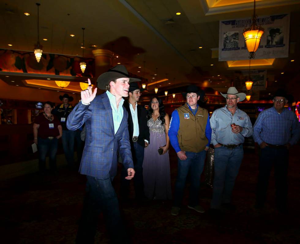 National Finals Rodeo contestant Boudreaux Campbell, of Crockett, Texas, arrives to walk on the ...