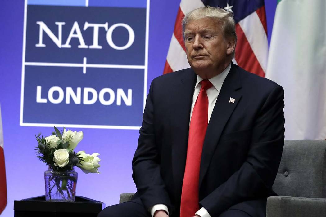 President Donald Trump listens as he meets with Italian Prime Minister Giuseppe Conte during th ...