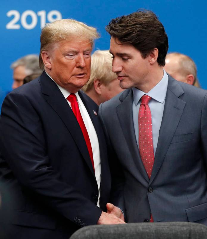 U.S. President Donald Trump, left, and Canadian Prime Minister Justin Trudeau shake hands prior ...