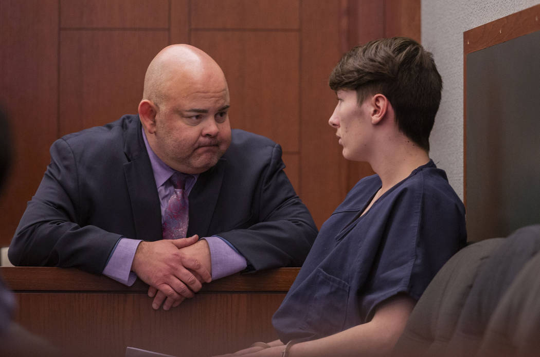 Defense attorney Erick Ferran, left, speaks with his client Noah Hadley before Hadley's sentenc ...