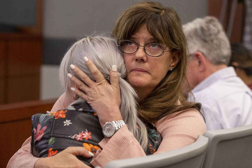 Amelia Claypool's mother, Lee Ann Pretto, hugs her daughter Olivia Claypool after Noah Hadley's ...