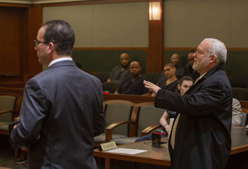 Defense attorney Richard Schonfeld, left, and Chief Deputy District Attorney Marc DiGiacomo spe ...