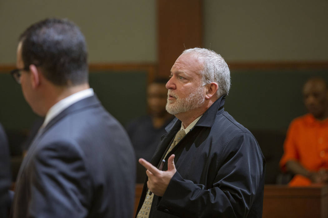 Chief Deputy District Attorney Marc DiGiacomo speaks to District Judge Michelle Leavitt during ...