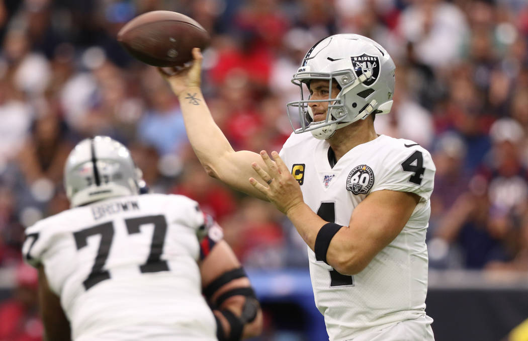 Oakland Raiders quarterback Derek Carr (4) throws the football during the first half of an NFL ...