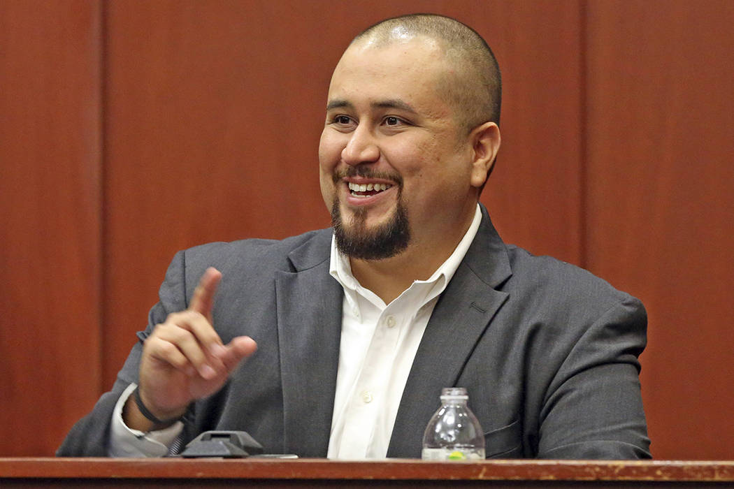 FILE- In this Sept. 13, 2016 file photo, George Zimmerman smiles as he testifies in a Seminole ...