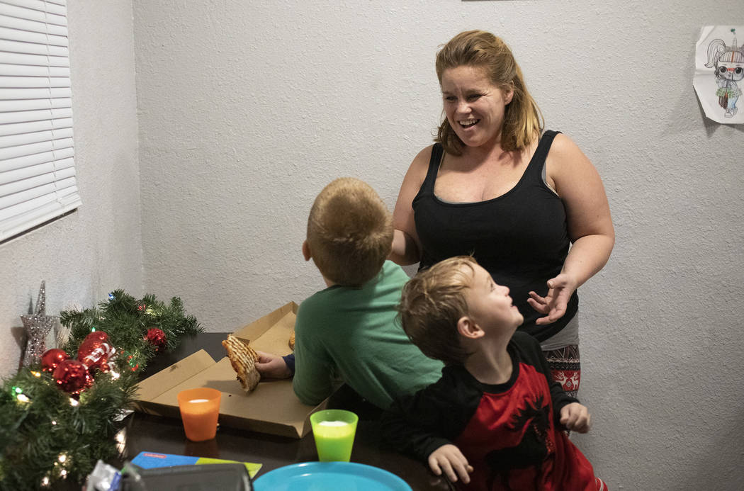 Joan Williams laughs with her sons Chase Huebner, 6, left, and John Huebner, 2, right, as they ...