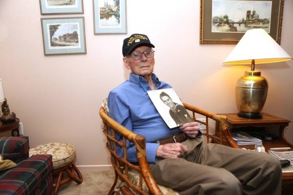 Lenoard Nielsen, a 93-year-old Pearl Harbor survivor, poses for a portrait at his home in Las V ...