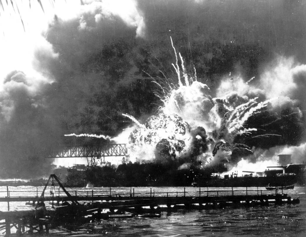 In this Dec. 7, 1941 file photo provided by the U.S. Navy, the destroyer USS Shaw explodes afte ...