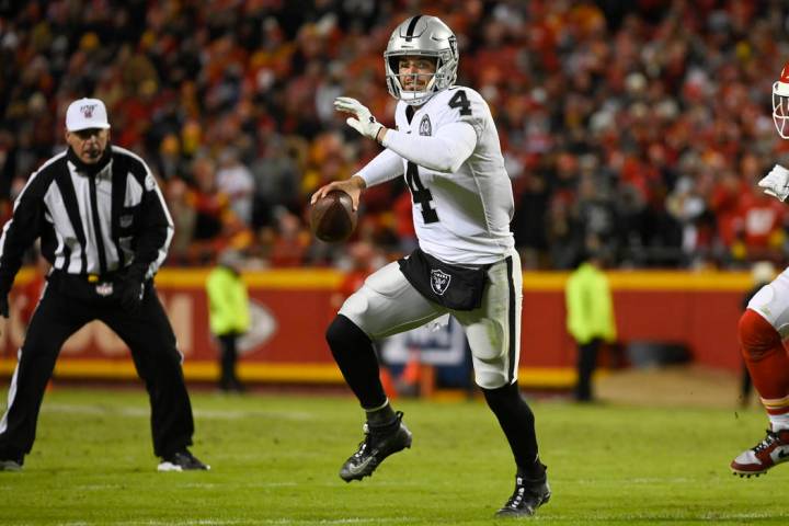 Oakland Raiders quarterback Derek Carr (4) scrambles against the Kansas City Chiefs during the ...