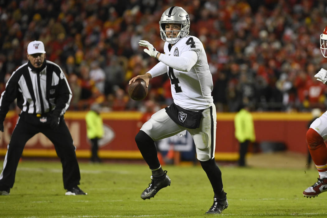 Oakland Raiders quarterback Derek Carr (4) scrambles against the Kansas City Chiefs during the ...