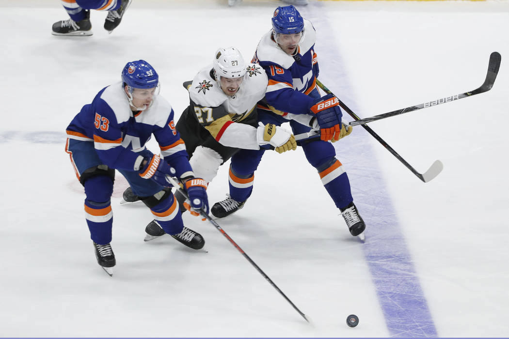 New York Islanders center Casey Cizikas (53) takes control of the puck as Vegas Golden Knights ...